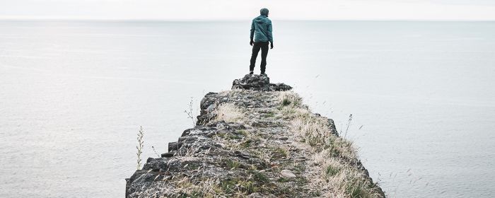 Person standing on the edge of the cliff