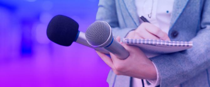 Latest press releases - microphone in front of audience