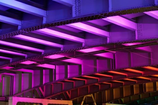 coloured lights underneath bridge
