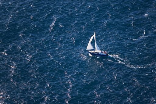 Sailboat in blue ocean