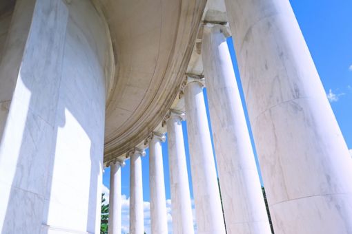 Seven white building pillars