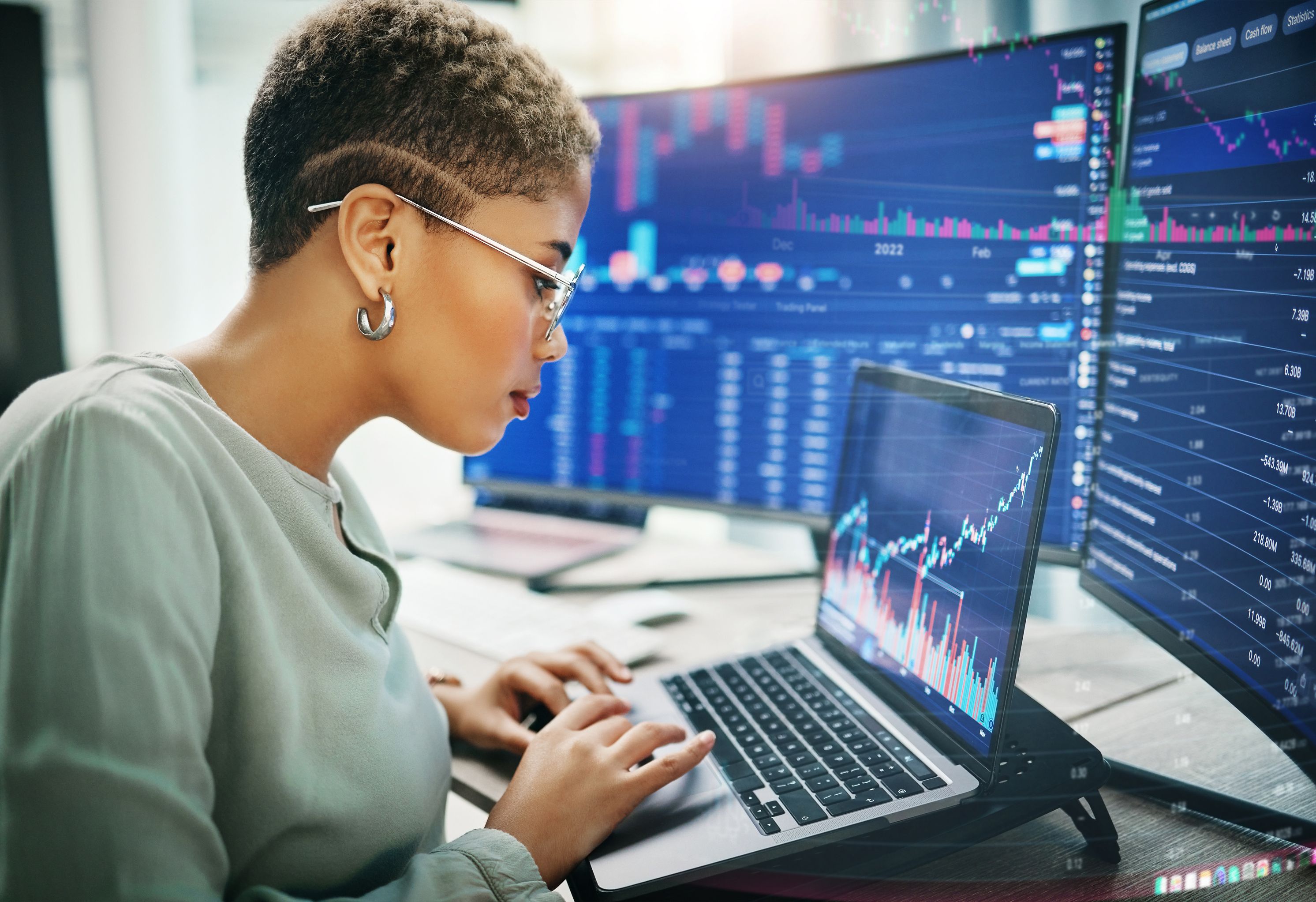 short haired woman looking at investment graph