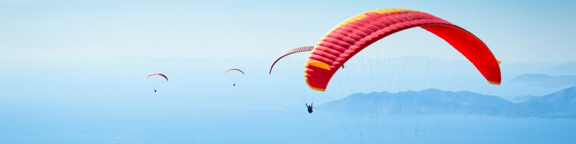 Shot of red paragliders