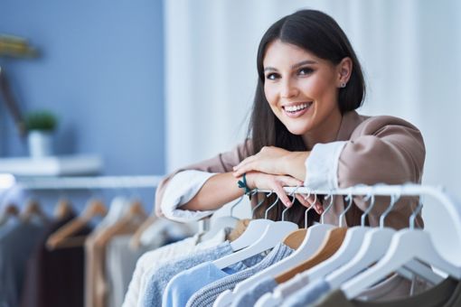 Young woman as a store manager with clothes; Shutterstock ID 2084945089; purchase_order: 