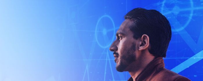 Side profile of man with data points moving behind