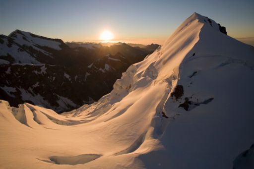 snowy mountain peak sunrise