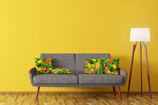 Sofa and floor lamp against a yellow wall
