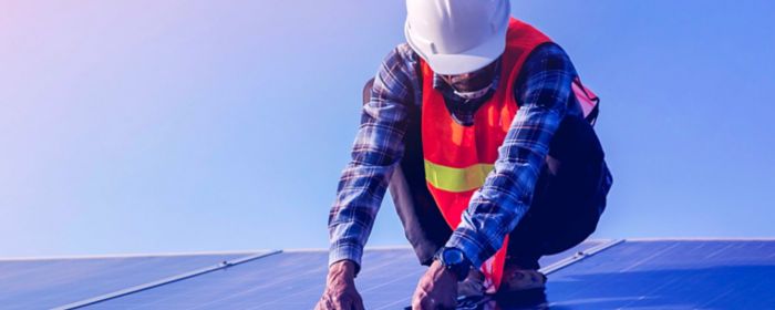 Man working on solar panels