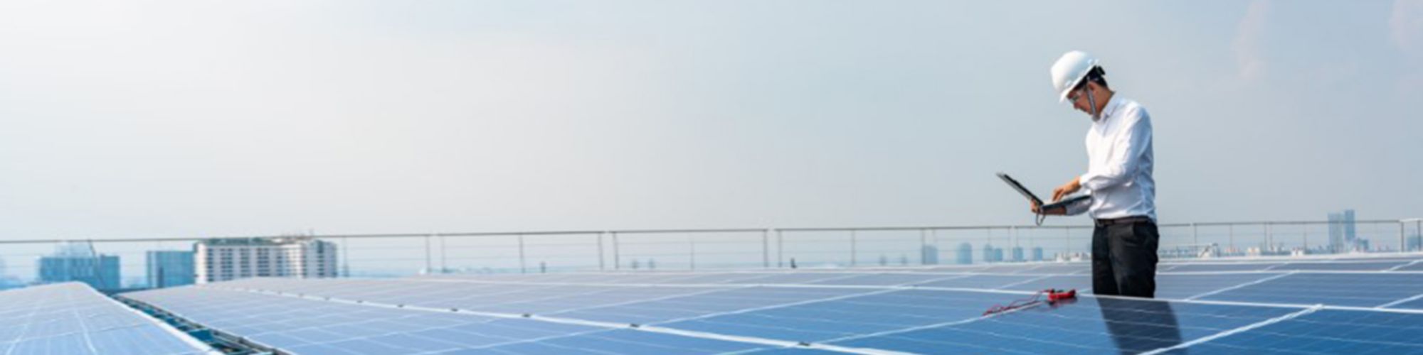 man-working-next-to-solar-panels