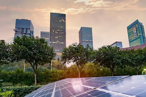 Solar panels with city in background