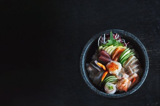 Sushi vegetable bowl on black table