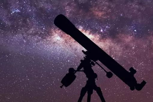 telescope silhouette with a sky of full of stars