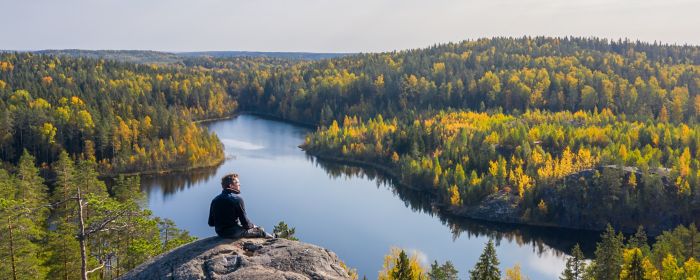 man-sitting-on-top-of-mountain