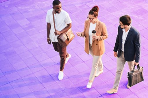 three business people walking