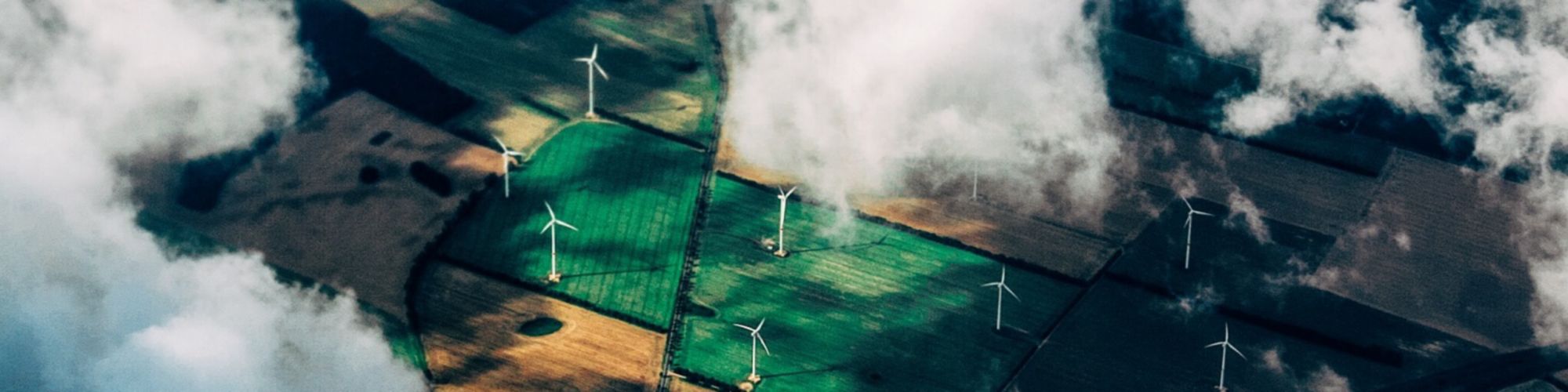 Top view green windmill field clouds