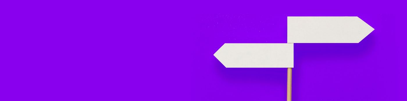 Two-directional sign on purple background