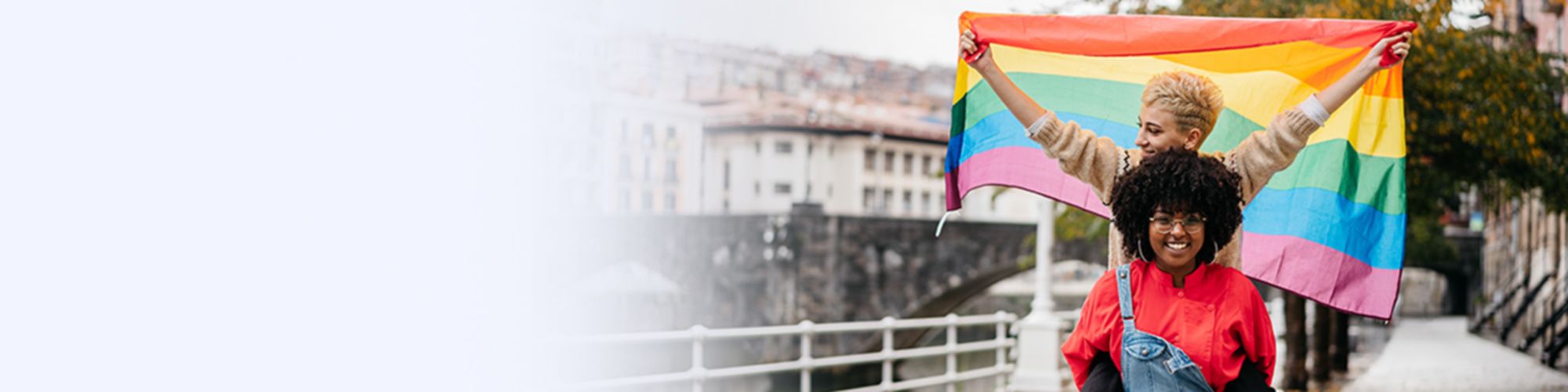 Two girls with LGBTQ flag