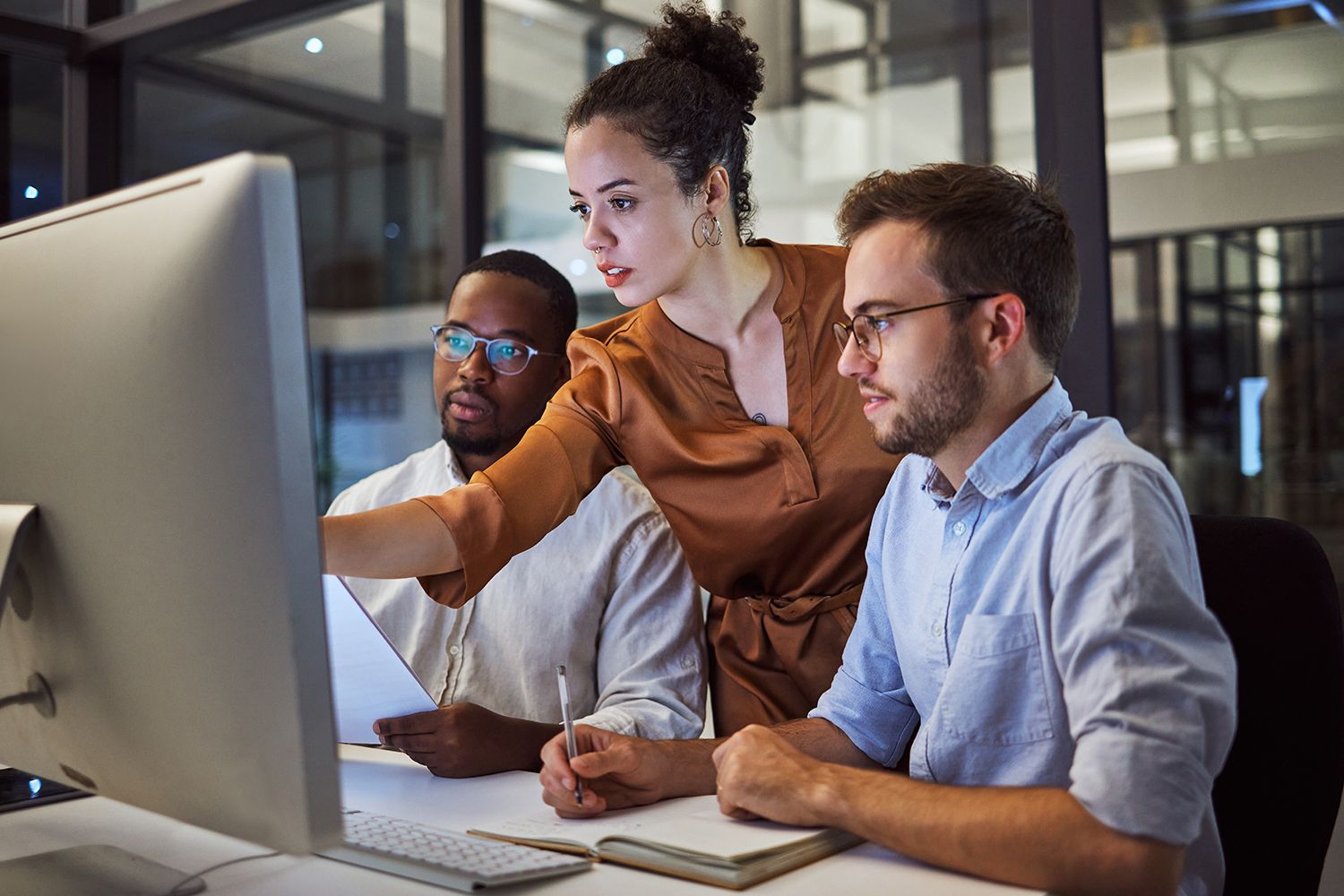 colleagues looking at screen 