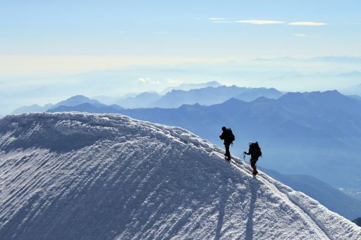 Two mountaineers reach the summit