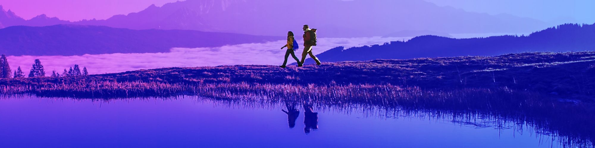 Two people walking in the mountains