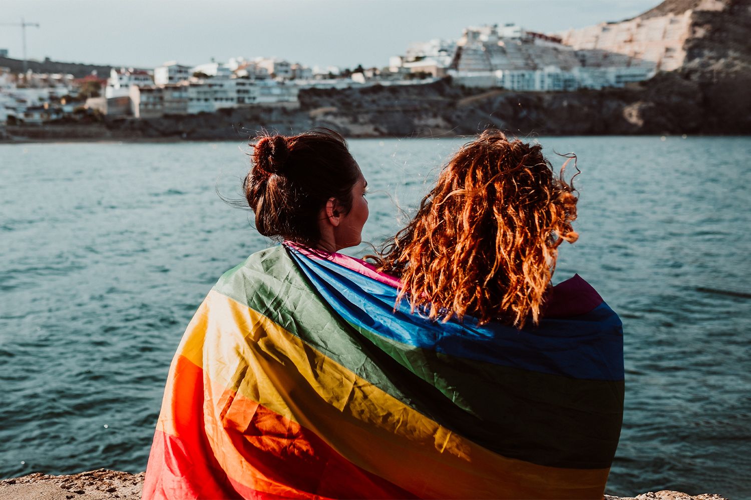 Two people with rainbow flag