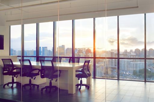 View of office conference room with sunset light in windows