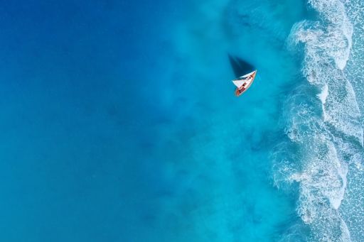 View of sailboat in ocean from above