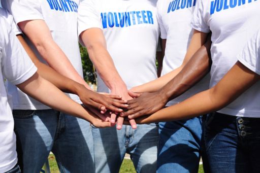 Volunteers gathering hands