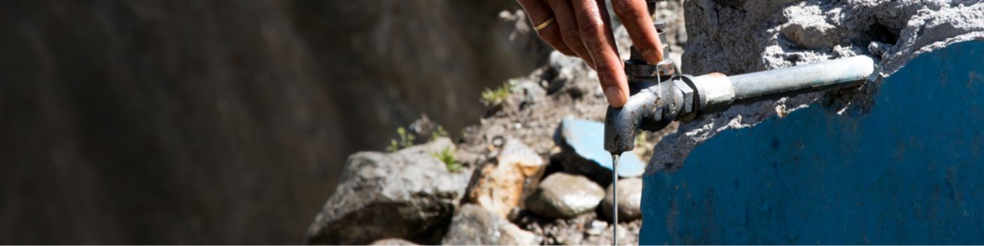 Water from a tap in a hilly mountain area