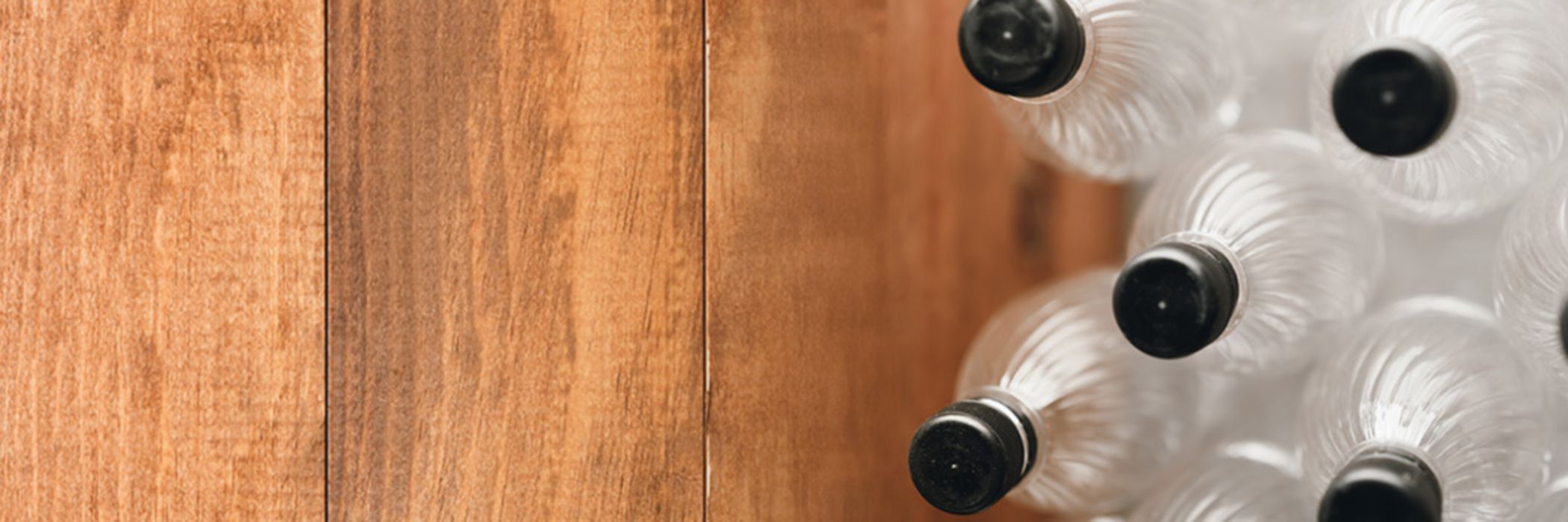 plastic bottles on wooden floor
