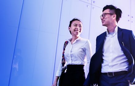 Woman and man laughing in a friendly situation