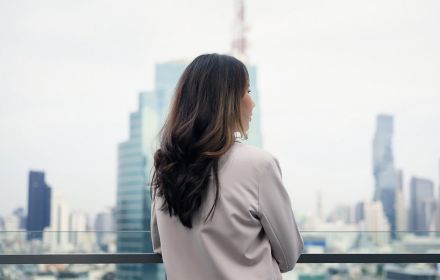 Woman looking out onto skyline