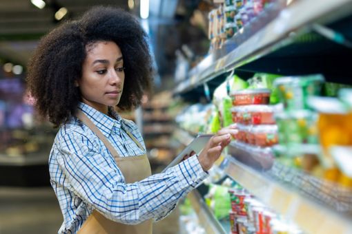 Woman checking inventory at super mart