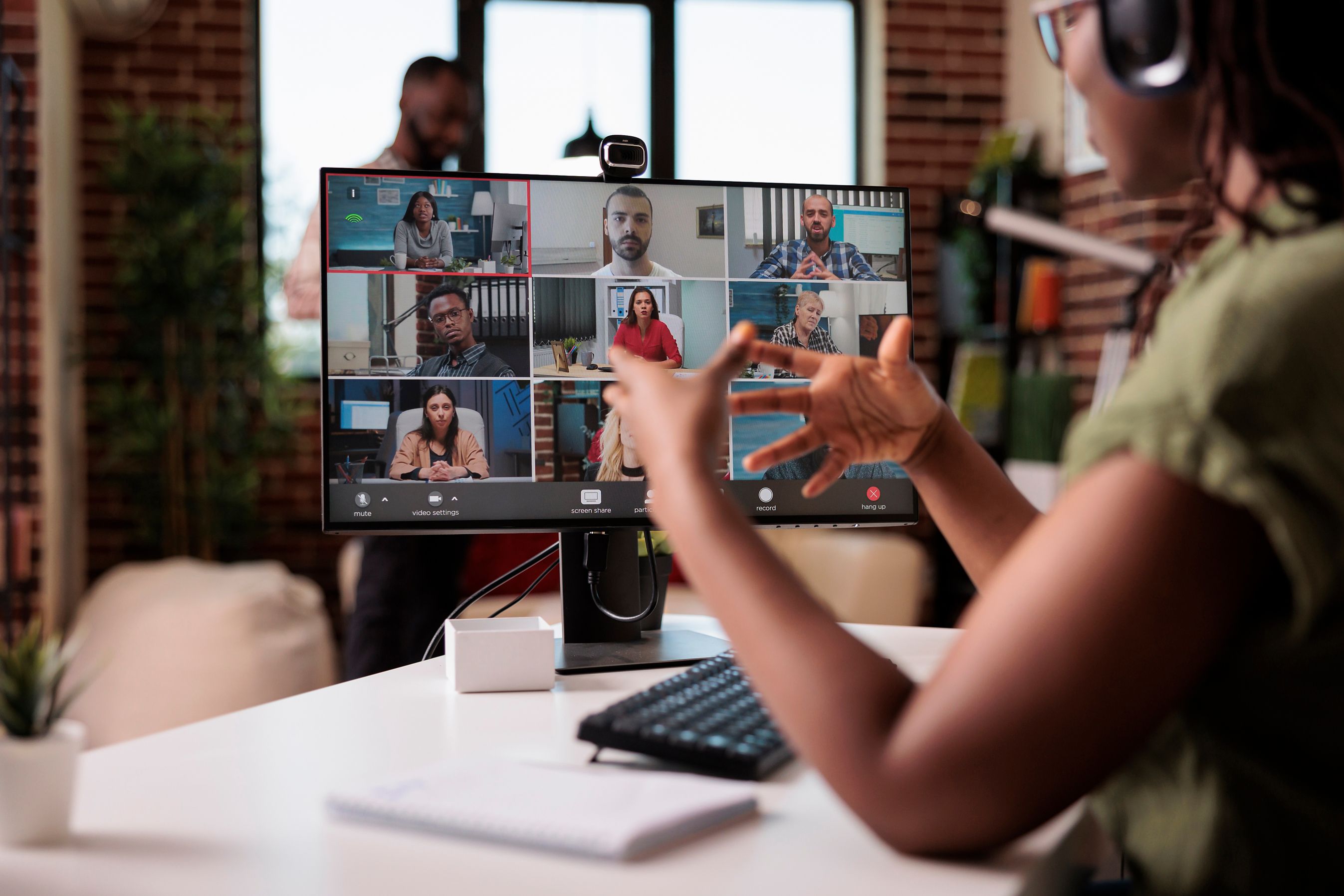 woman gesturing in conference call