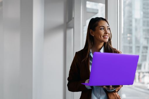 Woman holding a laptop