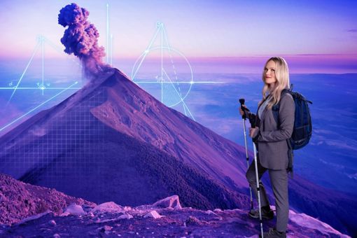 Woman in a suit hiking a volcano
