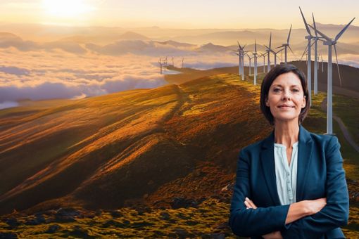 Woman in formals against mountains windmills