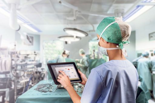 Woman in operation theatre with ipad