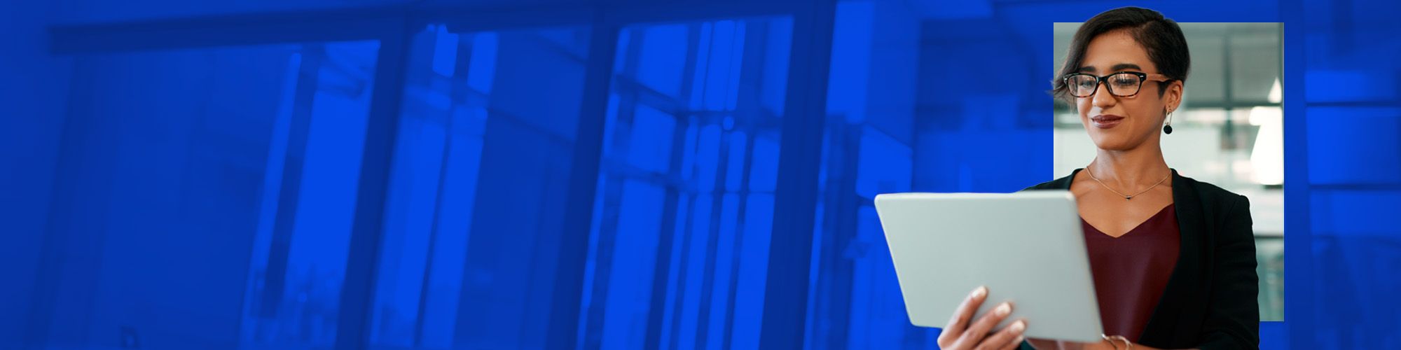 woman looking at tablet