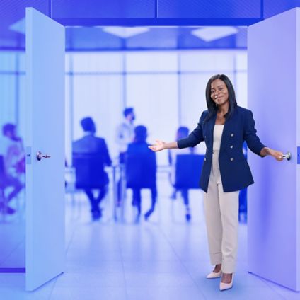 Woman opening a glass conference room door