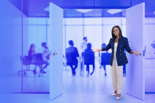 Woman opening a glass conference room door