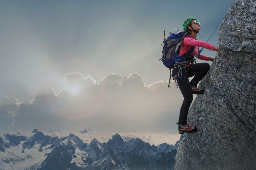 Mountain climber on the side of a cliff