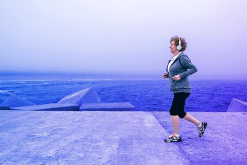 woman running with headphones on