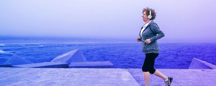 woman running with headphones on