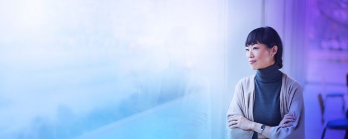 Woman smiling looking out window