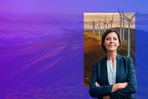 Woman standing with crossed arms with a backdrop of wind turbines in a field with a purple overlay