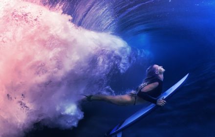 Woman surfing underwater