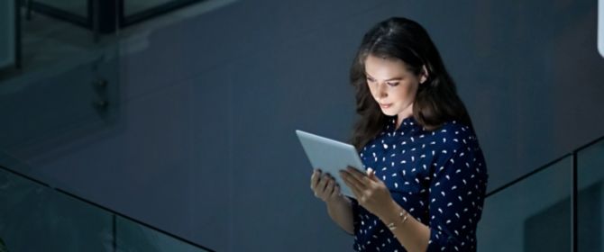 Woman using tablet in office