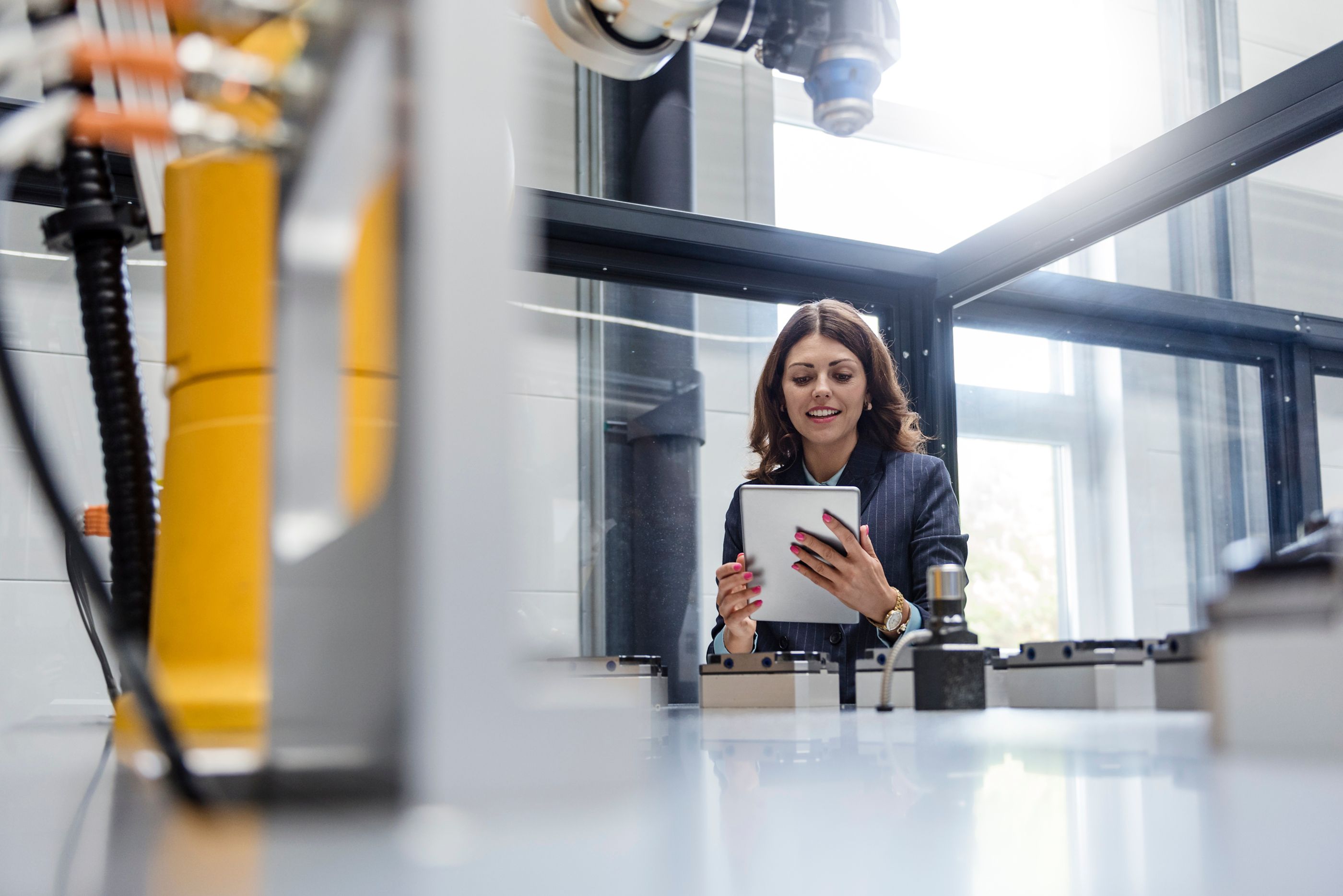 woman using tablet in high tech lab