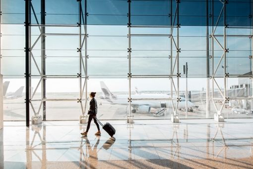 Woman walking with a suitcase